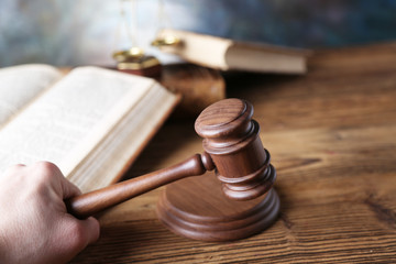 Law theme, mallet of judge, wooden gavel, books