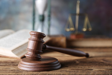 Law theme, mallet of judge, wooden gavel, books