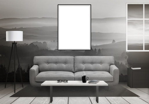 Isolated vertical art frame on wall. Window, sofa, lamp, plant, glasses, book, coffee on table in living room interior. 