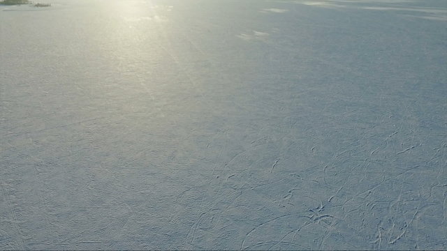 flying over the frozen sea. Sunset on the Sea in winter. 