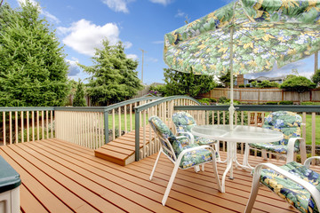 Large deck with nature patterned table set.