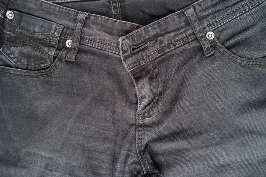Closeup detail of black denim jeans trousers pocket