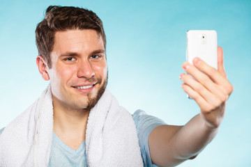 Happy half shaved man taking selfie self photo.