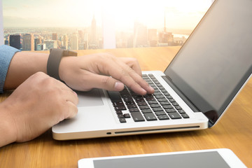 Close up of business man hand working on laptop computer