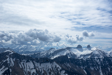 Large clouds over the Swiss Alps, looking from a mountain near Montreux called Rochers-de-Naye. As seen from the distance, there are two summits called Tour de Mayen and Tour d'Ai.