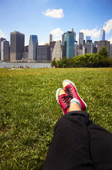 Red sneakers on green grass