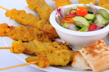 Traditional Thai style, Grilled pork satay with peanut sauce and toast.