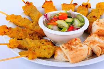 Traditional Thai style, Grilled pork satay with peanut sauce and toast.
