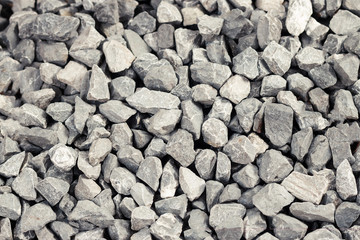 Background of gray granite gravel texture closeup details.