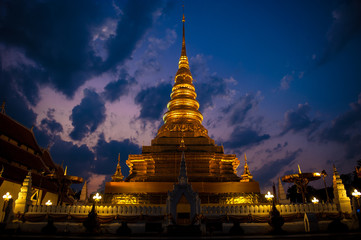 Fototapeta premium The golden temple Landmark of Nan is Wat Phra That Charehang was built in 1355. It is the most sacred wat in Nan Province Thailand