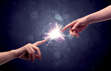 Hands reaching to light a spark