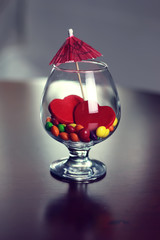 glass with candy pill