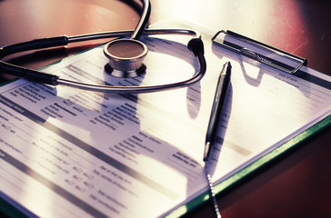 cardiologist stethoscope paper insurance