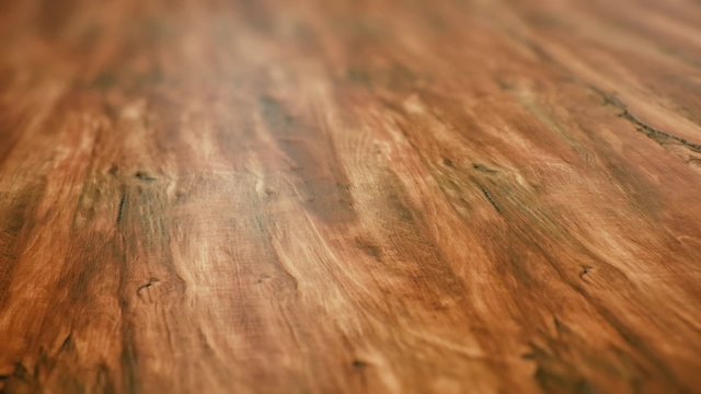 A looping pan over an elegant wooden floor.