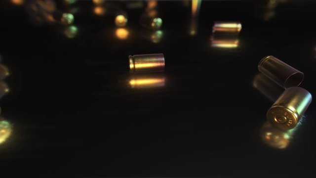 Looping camera movement over simple reflective surface covered in spent bullet casings.