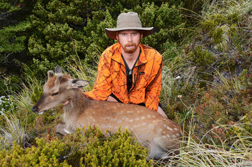 hunter with sika deer