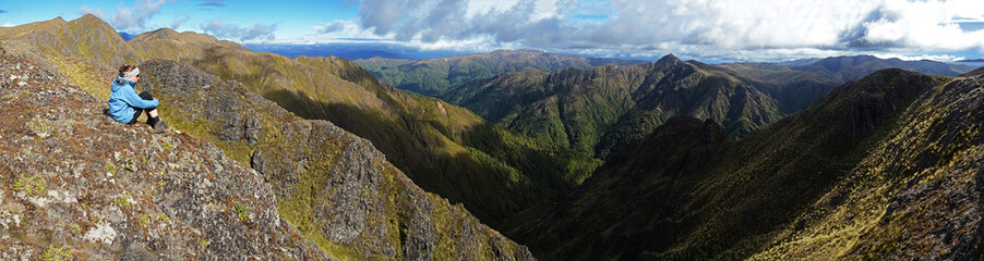 hiker enjoying view in mountains
