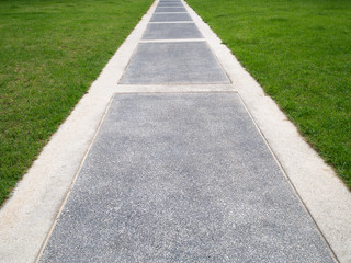 Bright green grass field and walkway for background wallpaper