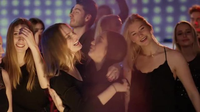 Girls hugging on dancefloor