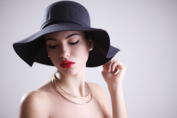 Attractive young woman in hat