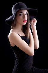 Fototapeta na wymiar Attractive young woman in hat