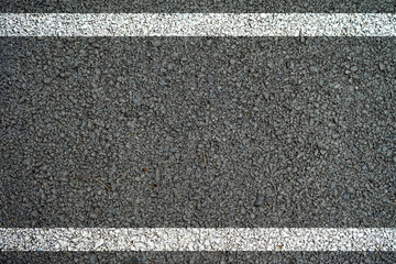 Fototapeta premium The lines on the asphalt road surface.