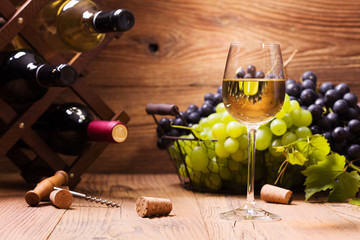 Glass of white wine, served with grapes