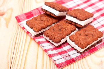 coockies with zephyr layer on wooden background
