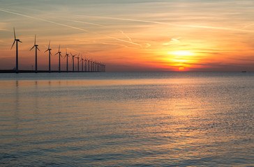 Fototapeta na wymiar Dutch off shore wind turbines during a beautiful sunset