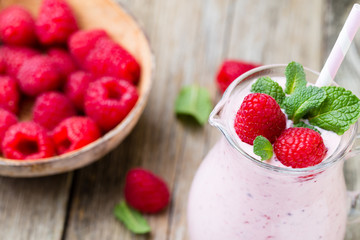 Raspberry milk shake with mint decor.