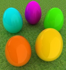 Fototapeta na wymiar Colored Easter eggs on a green grass