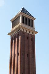 Fototapeta na wymiar View of the two Venetian Towers located in the Plaza de Espana, Barcelona, Spain.
