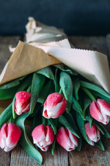 Colorful tulips on wooden table