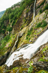 Fototapeta na wymiar Beautiful waterfall in Norway. Amazing Norwegian nature landscap