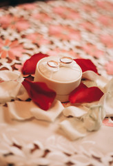  luxury wedding rings with stylish decoration near them