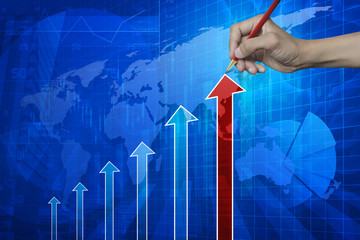 Hand pointing pencil to red arrow head with financial chart and