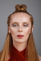 Studio shoot of futuristic woman with creative make-up and hairs