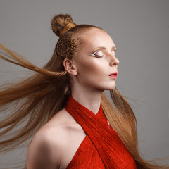 Studio shoot of futuristic woman with creative make-up and hairs