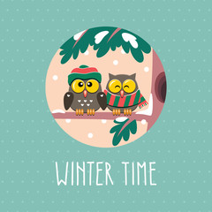 Card with cute winter owls dressed hat and scarf