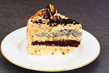 Sweets: Delicious fresh piece of cake with nuts.