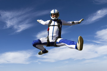 Fototapeta na wymiar Sportsman skydiver in free style.