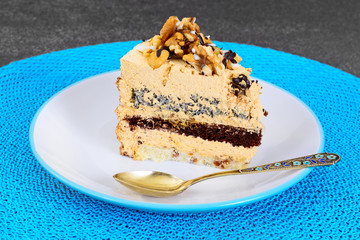 Sweets: Delicious fresh piece of cake with nuts. 