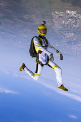 The girl parachutist in free style.