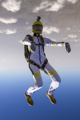 The girl parachutist in free style.