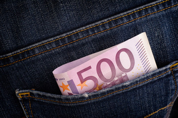 Five hundred euro banknote in back pocket of blue jeans