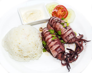 with rice and salad and sauce grilled squid