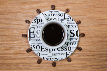 Cup of coffee and clock of coffee beans