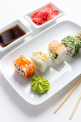 Sushi set on white wooden background