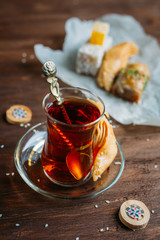 Turkish sweets and tea on a dark background