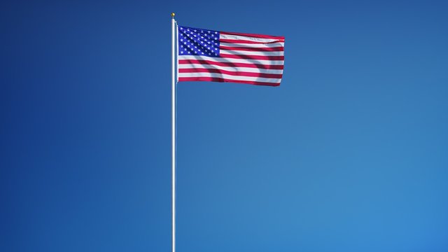 USA flag waving in slow motion against clean blue sky, seamlessly looped, close up, isolated on alpha channel with black and white luminance matte, perfect for film, news, digital composition